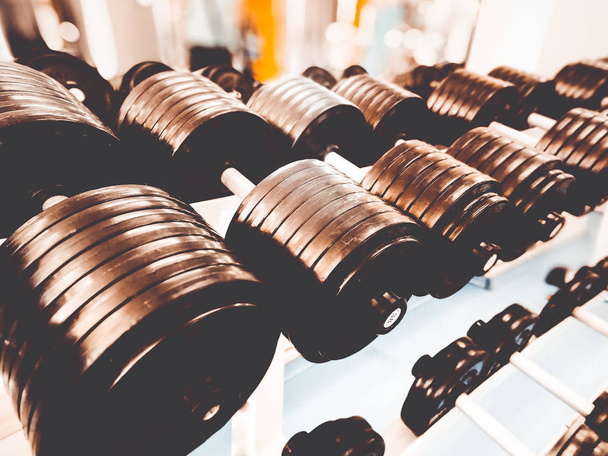 a row of dumbbells in the gym - Photo, Image