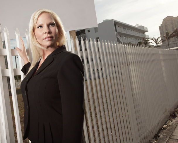 Businesswoman by the fence - Photo, Image