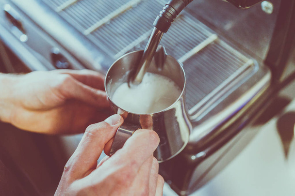 a coffee machine pours milk - Fotó, kép