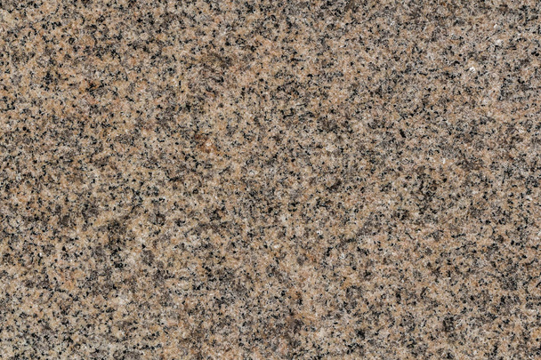 A beautiful texture of natural gray and yellow granite stone surface in the photo - Photo, Image