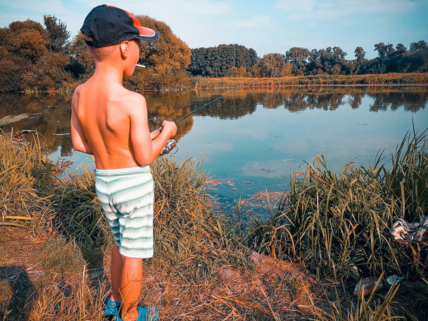 the boy is fishing - Fotó, kép
