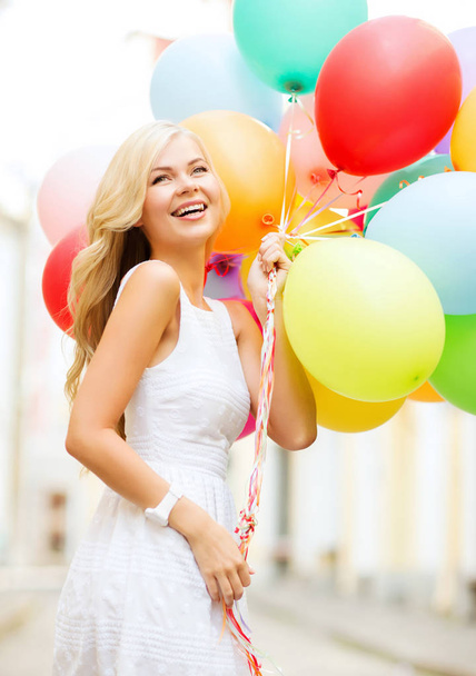 summer holidays, celebration and lifestyle concept - beautiful woman with colorful balloons in the city - Фото, зображення