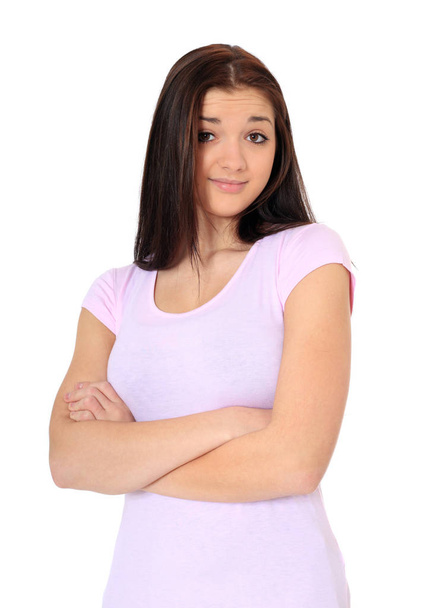 Attractive teenage girl with doubtful look. All on white background. - Foto, Imagem