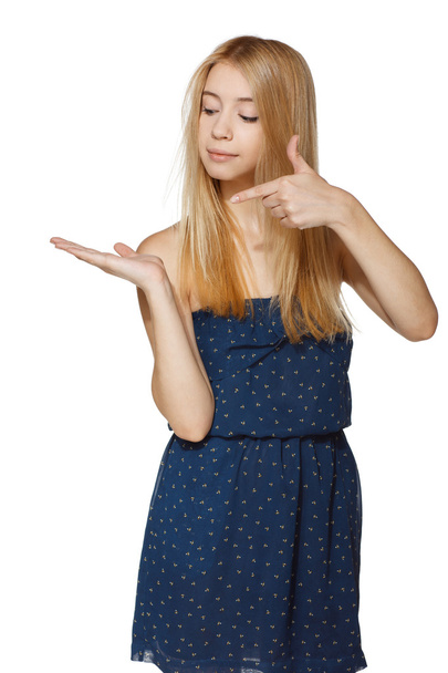 Girl holding blank copy space on her open palm - Photo, image
