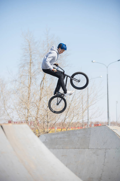 A bmx rider in the skatepark in the air - Photo, Image