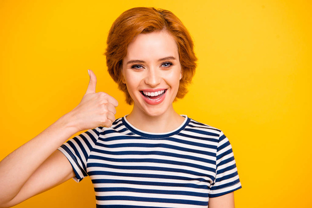 Close up photo beautiful amazing she her lady easy-going thumb up amazed glad advising new product wearing casual striped white blue t-shirt outfit clothes isolated yellow bright vibrant background - Valokuva, kuva