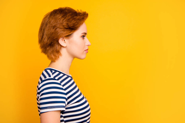 Close up side profile photo beautiful amazing she her lady look empty space not smiling wondered listen wear casual striped white blue t-shirt outfit clothes isolated yellow bright background - Foto, imagen