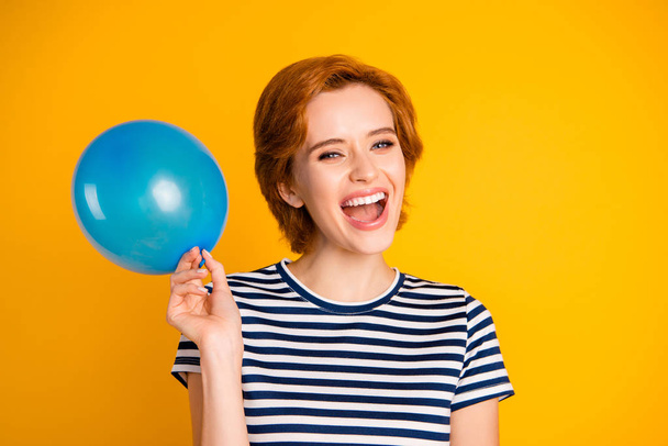 Close-up portrait of her she nice lovely charming attractive cheerful cheery glad girl with blue baloon birthday festal event isolated over bright vivid shine yellow background - Foto, Imagem