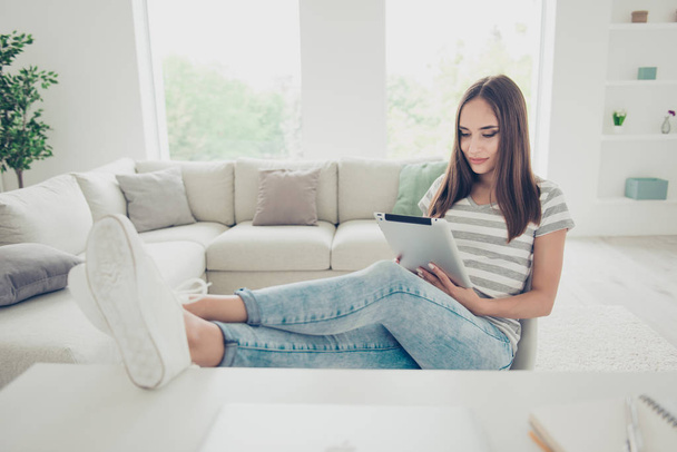 Close up photo beautiful she her lady hands arms hold e-book- e-reader chatting sms message relatives friends wear jeans denim striped t-shirt sit comfort chair legs table house living room indoors - Fotoğraf, Görsel