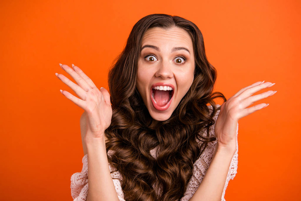 Close-up portrait of her she nice attractive lovely charming cute pretty adorable fascinating cheerful cheery wavy-haired lady showing excitement isolated over bright vivid shine orange background - Foto, afbeelding
