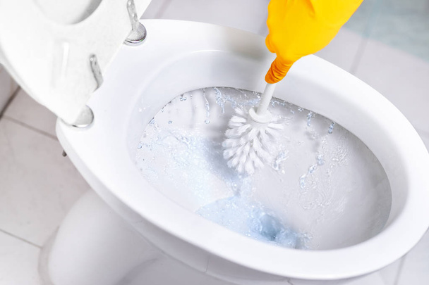 Toilet bowl close-up blue water - Foto, Imagen