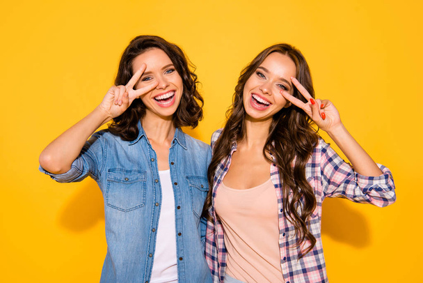 Portrait cute lovely fellow fellowship make v-signs place face eyes funny funky childish carefree summer spring checkered outfit long hair isolated vivid background satisfied content glad   - Foto, Imagem