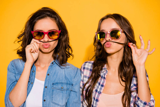 Close up  photo of charming beautiful cute teens teenagers satisfied glad summer travel  enjoy foolish wear checked jeans spring shirts isolated have free time weekend holidays on yellow background - Photo, Image