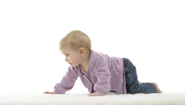 happy crawling baby with colored cubes, isolated on white - Photo, Image