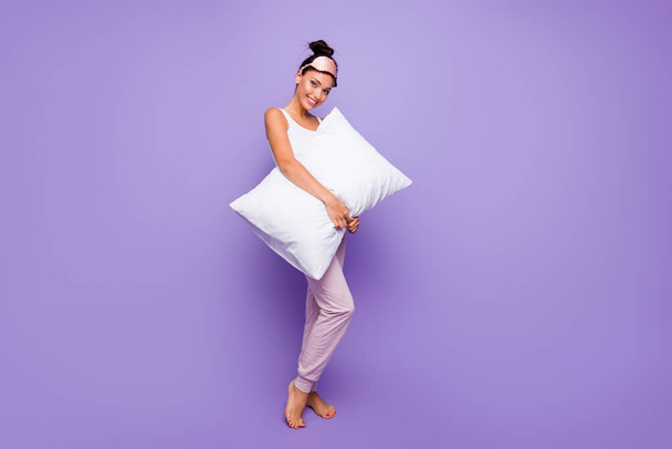 Full length side profile body size photo beautiful she her lady hold arms hands pillow no shoes feet foot satisfied wear sleeping mask pastel pants tank-top pajamas isolated violet purple background - Fotoğraf, Görsel