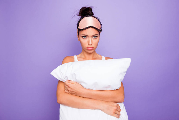 Close up photo beautiful negative her she lady hands arms palms hold cuddle big large pillow not fear expression wear sleeping pink mask casual white tank-top pajama isolated purple violet background - Foto, afbeelding