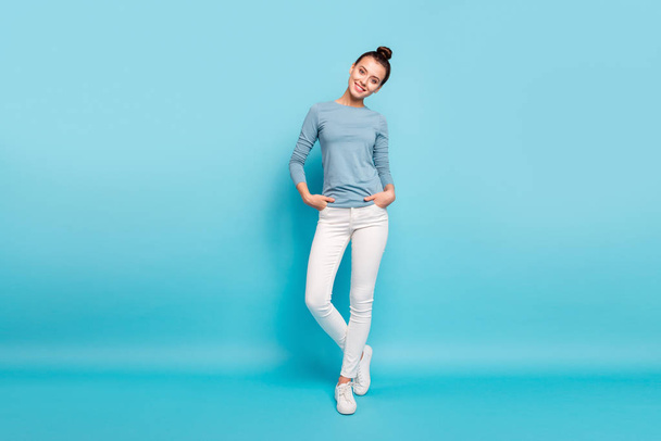 Full length body size photo beautiful amazing she her lady stylish hairstyle look interested curious wondered toothy pretty wear casual white pants sweater pullover isolated blue bright background - Foto, Imagen