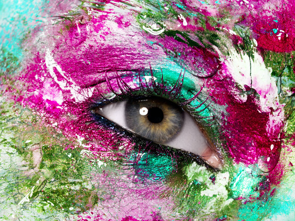 Beauty, cosmetics and makeup. Magic eyes look with bright creative make-up. Macro shot of beautiful woman's face with perfect art make up. Closeup of female eye. Body art - Photo, Image
