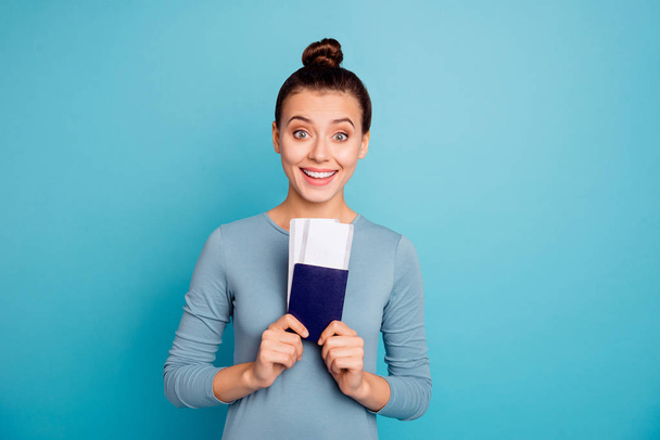 Close up photo beautiful amazing she her lady show parents friends hands arms hold paper transport tickets application first trip abroad wear casual sweater pullover isolated blue bright background - Foto, immagini