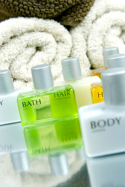 Bathroom products in bottles and towels in spa - Foto, Imagem
