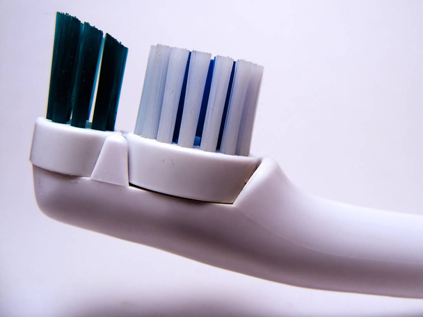 Electric toothbrush head shot on a white background. - 写真・画像