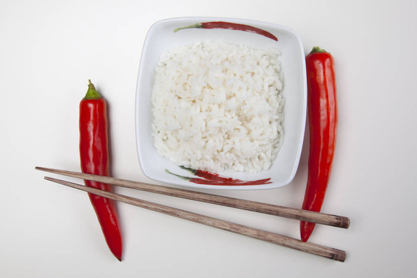 Bowl of white rice isolated on white - Fotó, kép