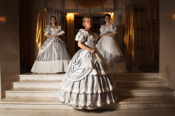 Three young women in ball gowns - Photo, Image