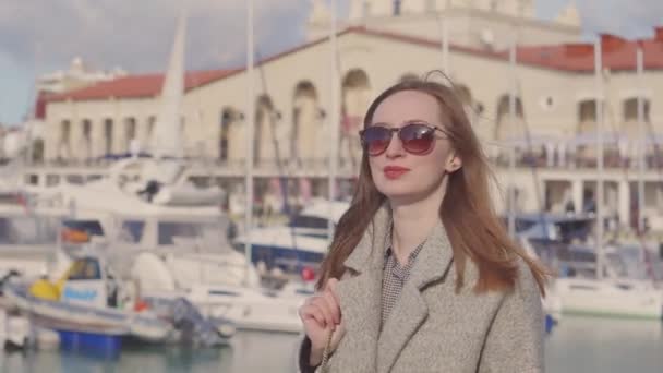 Trendy girl in port in warm spring. - Footage, Video