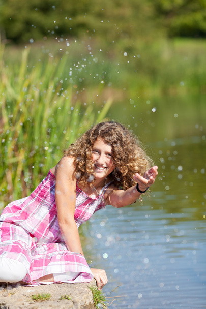 Happy Teenage Girl Playing With Water - Foto, afbeelding