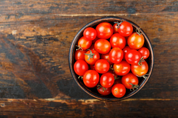 cherry tomatoes on wooden background - Fotó, kép