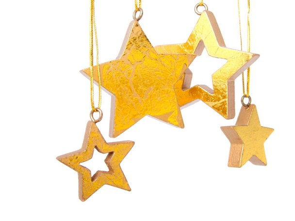 Golden Christmas stars, isolated on white background - Фото, изображение