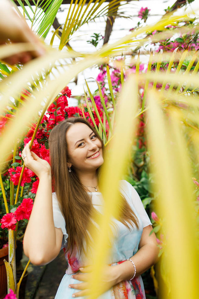 beautiful girl in a wreath of flowers - Фото, изображение