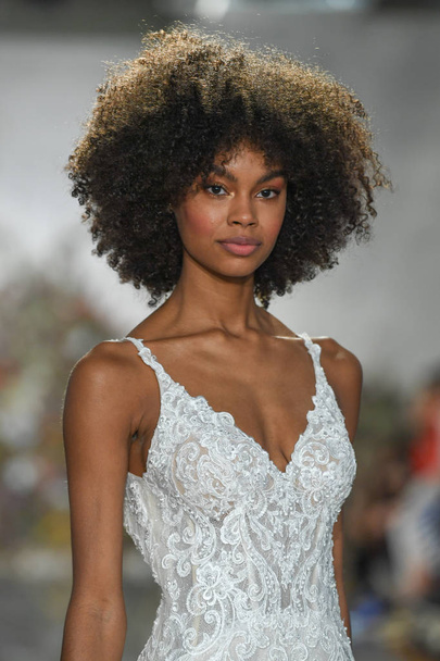 NEW YORK, NY - APRIL 11: A model walks the runway during the Morilee by Madeline Gardner Spring 2020 bridal fashion show at New York Fashion Week: Bridal on April 11, 2019 in NYC. - Photo, image