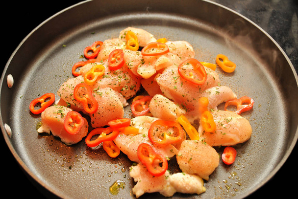 Boneless Chicken Cooking with Sweet Peppers & Parsley  - Photo, Image