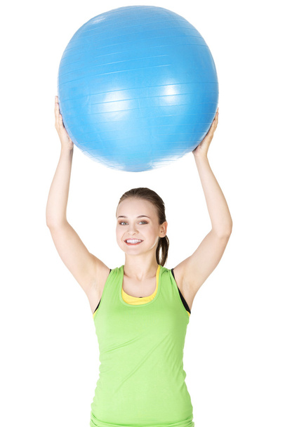 Healthy lifestyle woman with pilates exercise ball. - 写真・画像