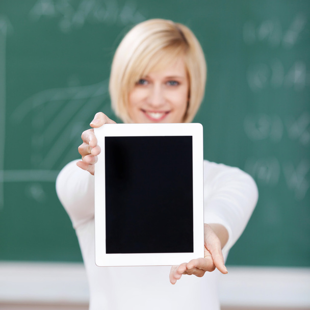 Female Student Showing Digital Tablet In Classroom - Foto, immagini