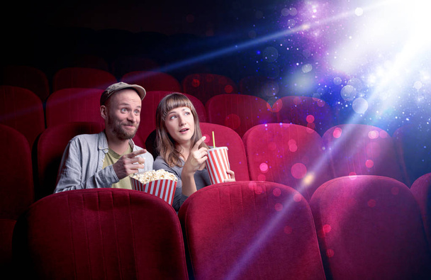Romantic couple sitting at spectacle - Photo, image