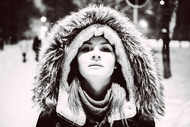 girl in fur hood. black and white portrait, close-up - Фото, зображення