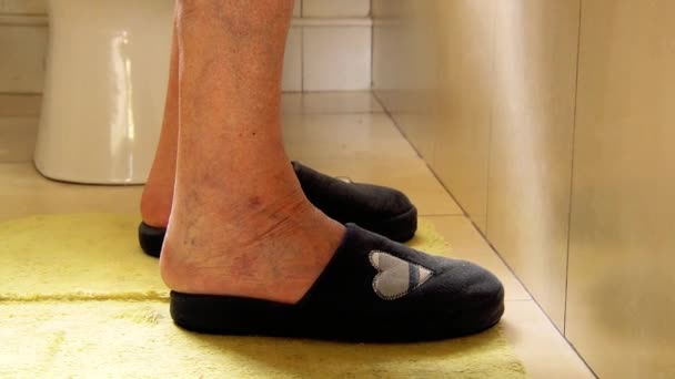 Old Woman's Feet In Slippers Entering The Bathtube. - Footage, Video