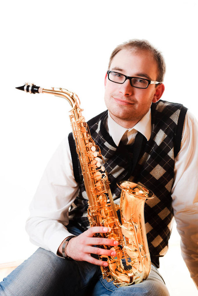 portrait of a man with a saxophone - Фото, изображение