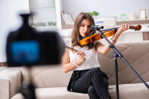 Female beautiful blogger playing violin - Photo, Image