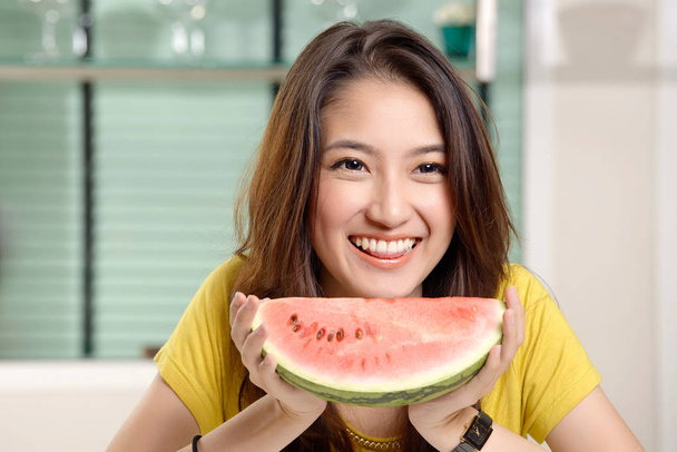 Young Asian cute woman and Eating watermelon - Valokuva, kuva