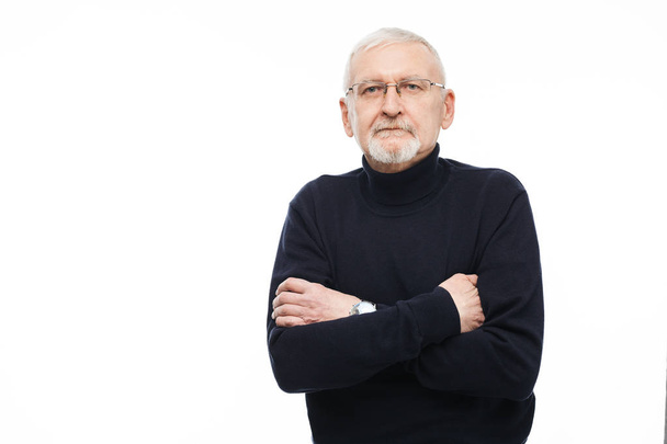 Old handsome man with gray hair and beard in eyeglasses and blac - Photo, Image