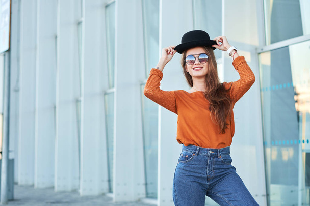 Young happy girl wearing stylish black hat - Fotoğraf, Görsel