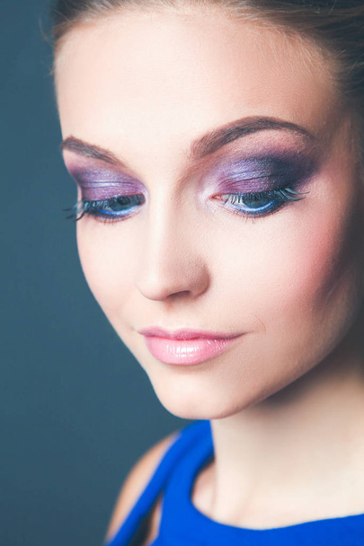 Studio shot of a beautiful young woman wearing professional makeup. - Photo, Image