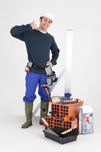 Builder suggesting you call him - Фото, изображение