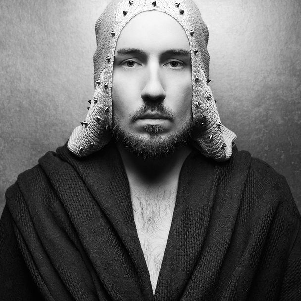 Art-fashion ethnic portrait of a serious king-warrior in white c - Photo, image