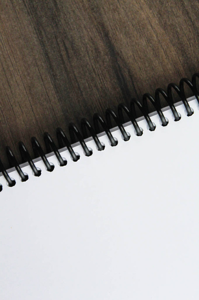 Spiral notepad paper on the wooden background - Foto, imagen