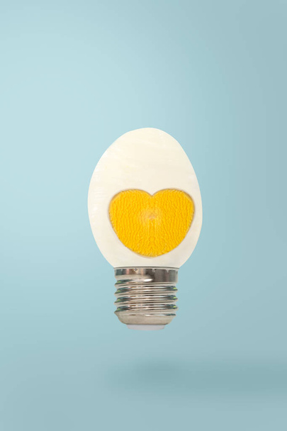 Half boiled egg with lamon blue p botton background. - Foto, imagen