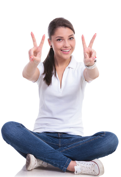 casual woman sits & victory - Photo, image